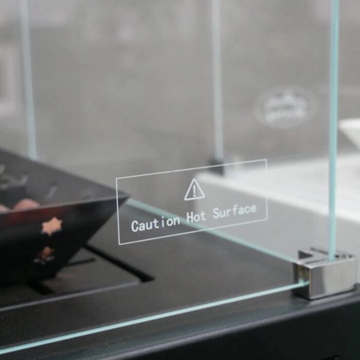 Sidoglas med varningslogotyp till Muztag Malaga